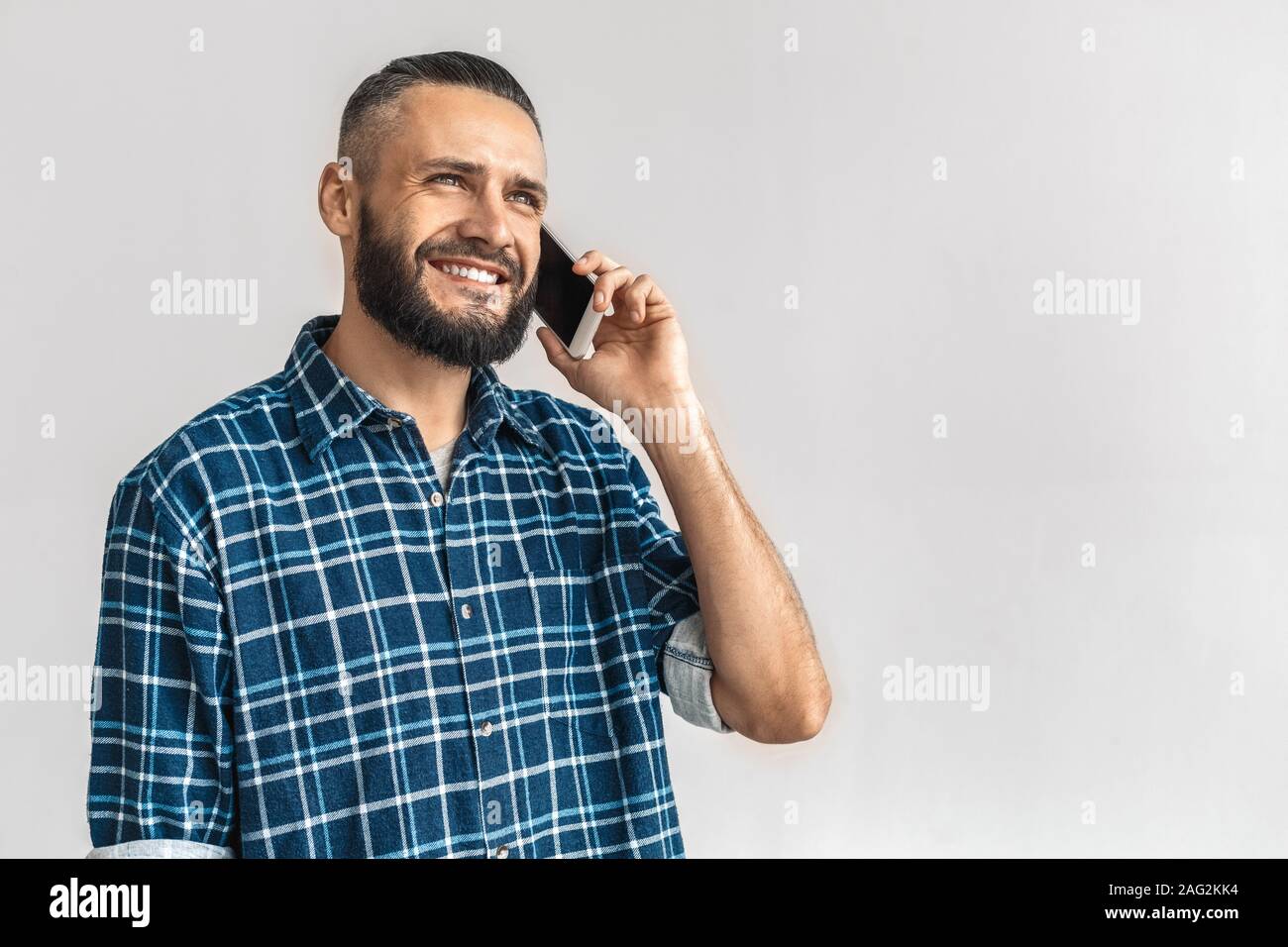Mature bearded man call on modern smartphone Stock Photo
