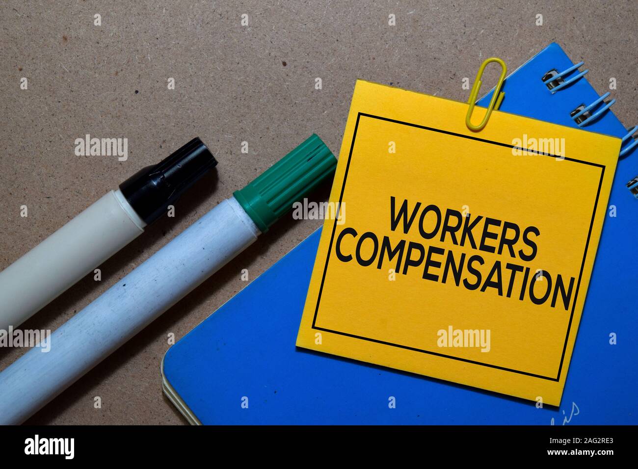 Workers Compensation write on sticky notes isolated on Office Desk ...