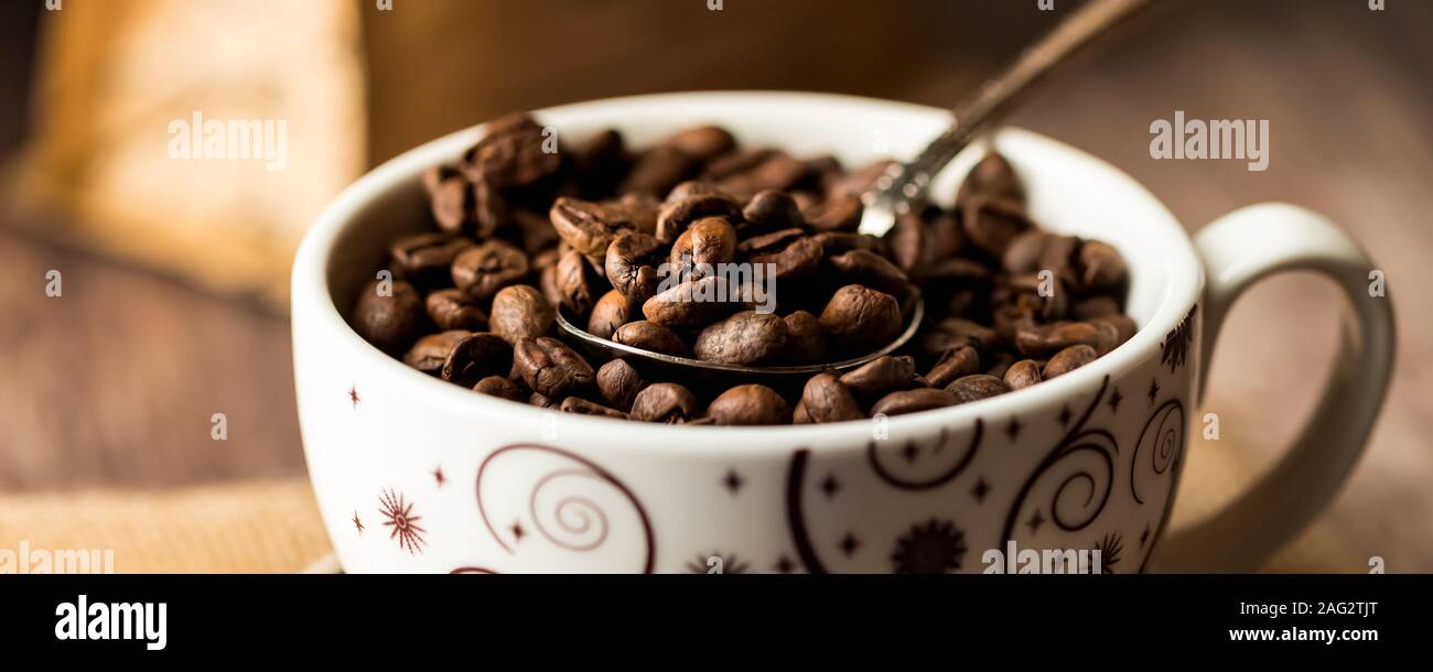 A cup full of coffee beans. Stock Photo