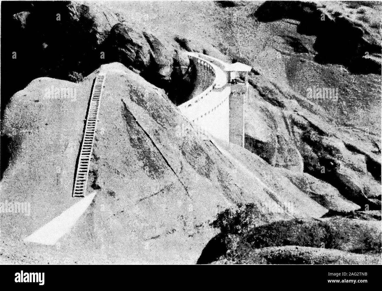 . Principles of irrigation engineering, arid lands, water supply, storage works, dams, canals, water rights and products. Fig. a.—Earth and rockfiU dam under construction, with low concrete corewall, gravel and earth is being dumped on upper side with loose rock below,Minidoka, Idaho.. Fio. B.—Concrete structure for regulating floods. East Park dam, Orland Project, Cal. (Facing Page 234) Plate XV Stock Photo