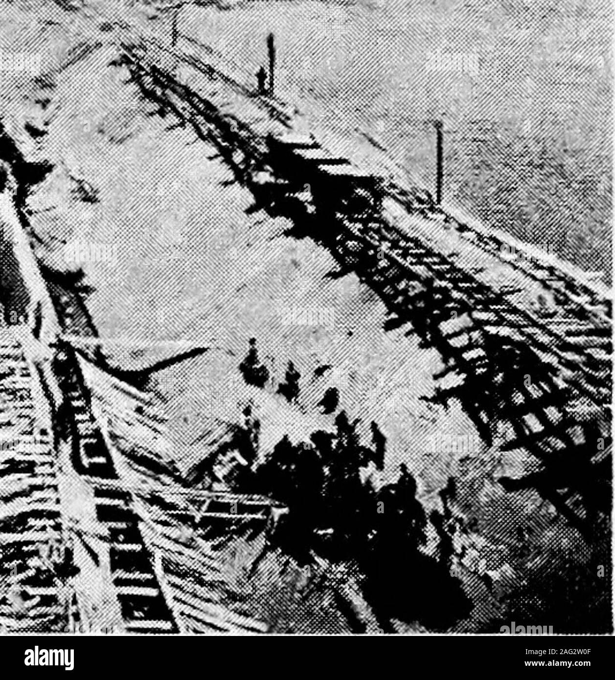 . Principles of irrigation engineering, arid lands, water supply, storage works, dams, canals, water rights and products. Fig. a.—Earth and rockfiU dam under construction, with low concrete corewall, gravel and earth is being dumped on upper side with loose rock below,Minidoka, Idaho. Stock Photo