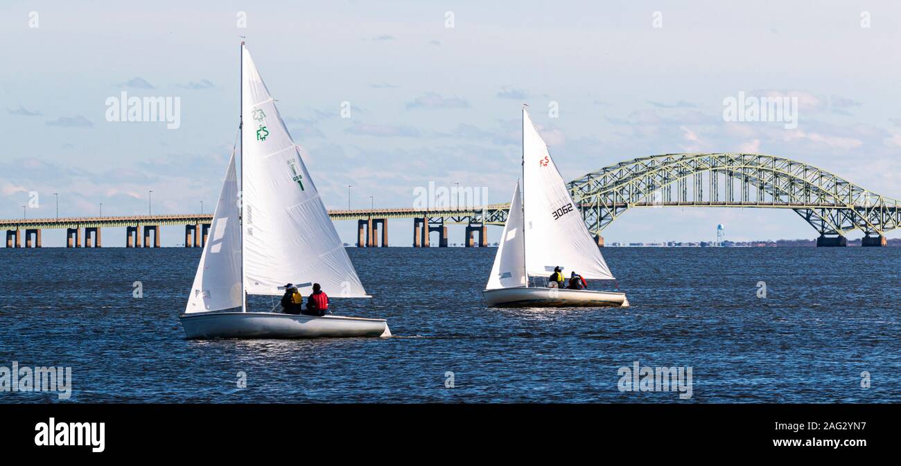 Babylon, New York, USA - 7 December 2019: Small sailboats in the great south bay heading back to West Islip during a winter regatta in December 2019. Stock Photo