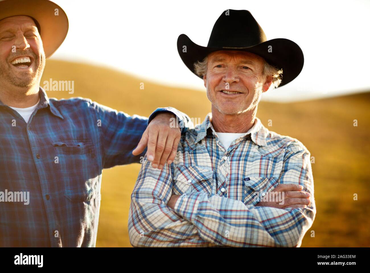 Two Cowboys Talking Stock Photo - Alamy