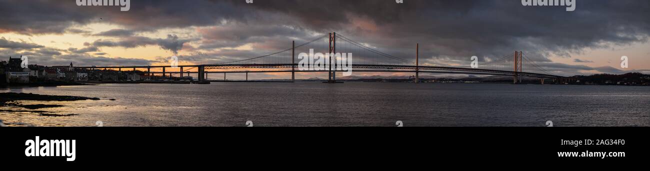 The Forth Road Bridge and Queensferry Crossing at sunset Stock Photo