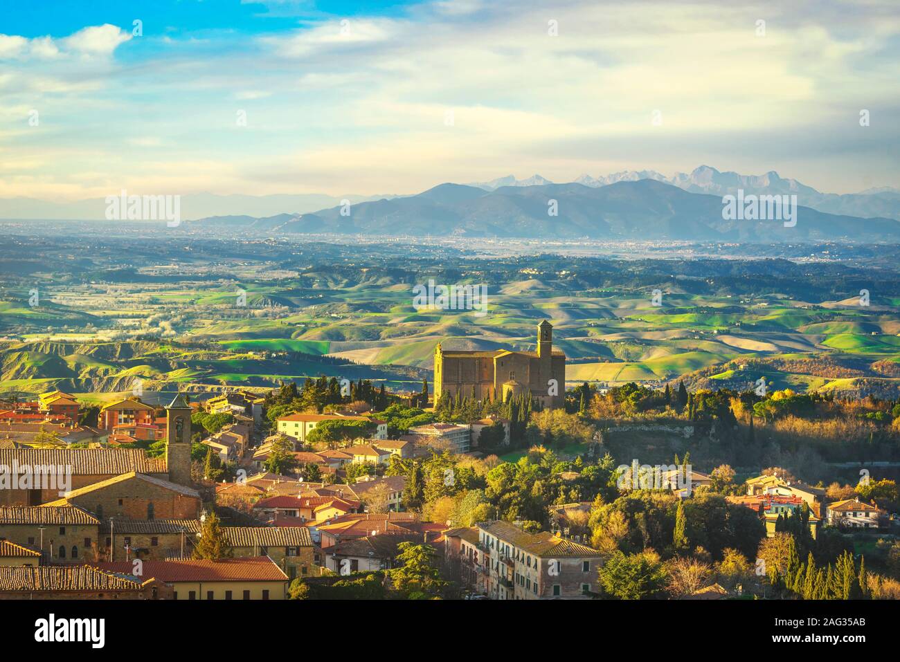 Tuscany, Volterra panoramic view landscape and San Giusto Nuovo medieval church at sunset. Italy, Europe Stock Photo