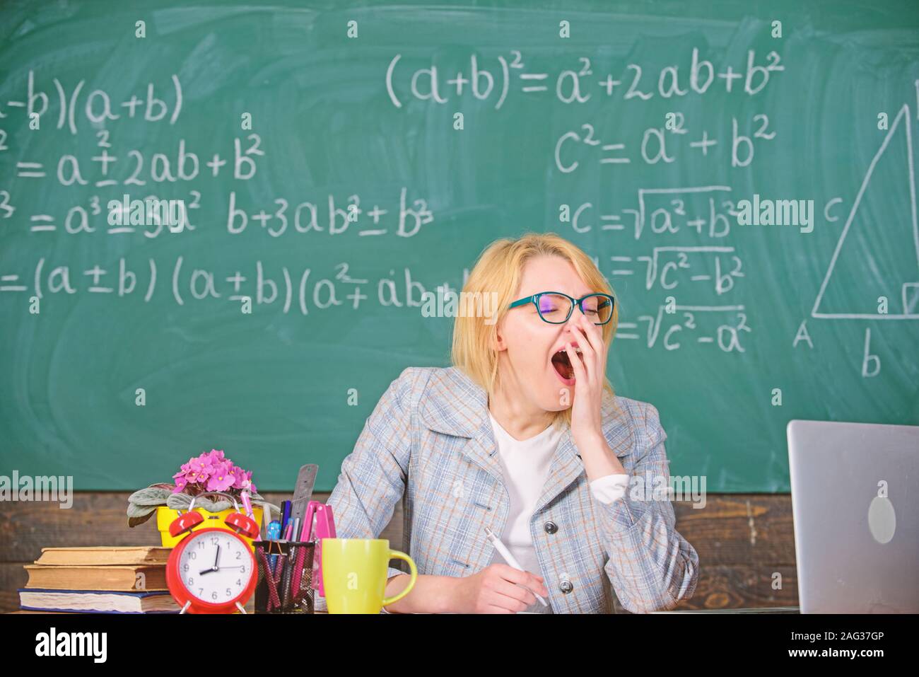 deeply entry assembly Working conditions for teachers. Working conditions which prospective  teachers must consider. Work far beyond the actual school day. Woman tired  teacher sit table classroom chalkboard background Stock Photo - Alamy