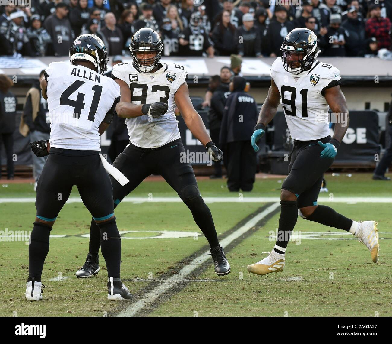 Jacksonville Jaguars defensive lineman Calais Campbell (93) and defensive  end Hunter Dimick (79) walk to the field before an NFL football practice,  Friday, May 26, 2017, in Jacksonville, Fla. (AP Photo/John Raoux