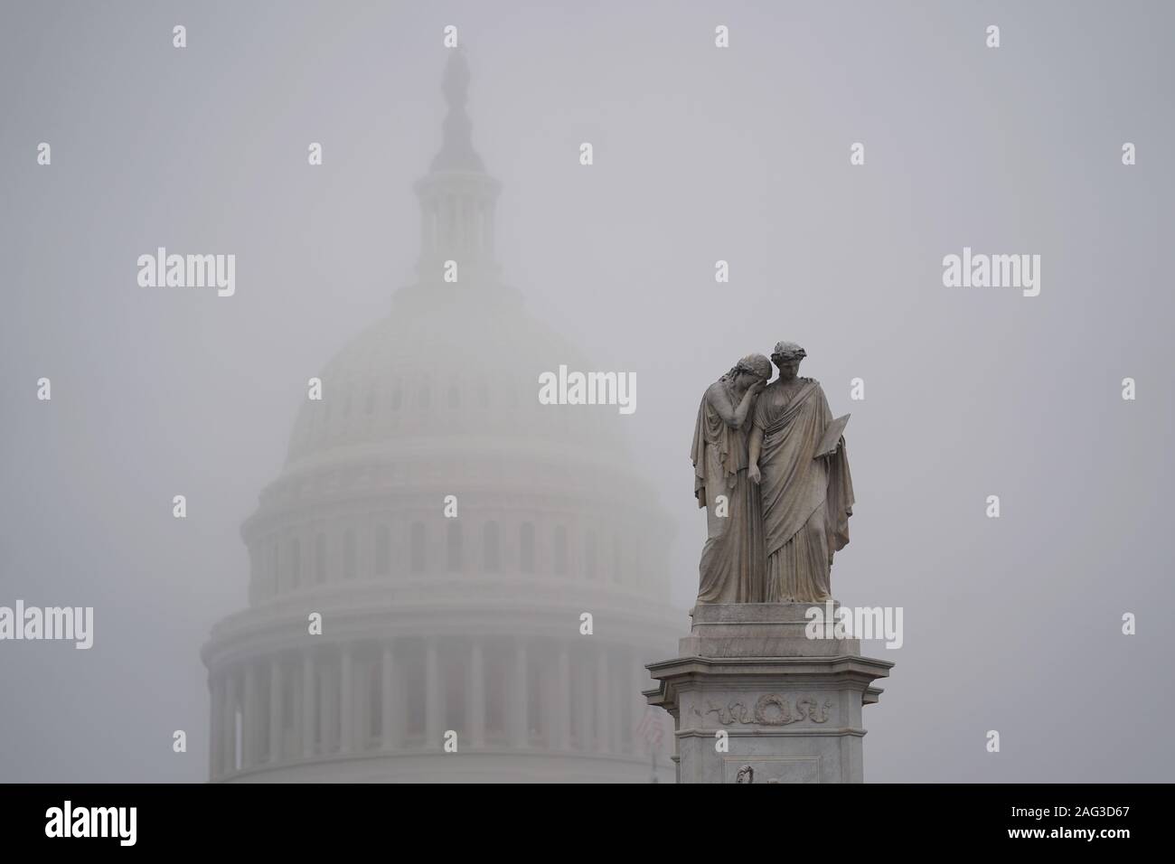 Washington, USA. 17th Dec, 2019. The Capitol Hill is shrouded in fog in Washington, DC, the United States, on Dec. 17, 2019. U.S. President Donald Trump on Tuesday sent a six-page letter to House Speaker Nancy Pelosi, slamming the House Democrats impeachment effort as an 'illegal, partisan attempted coup' and an 'unprecedented and unconstitutional abuse of power.' Credit: Liu Jie/Xinhua/Alamy Live News Stock Photo