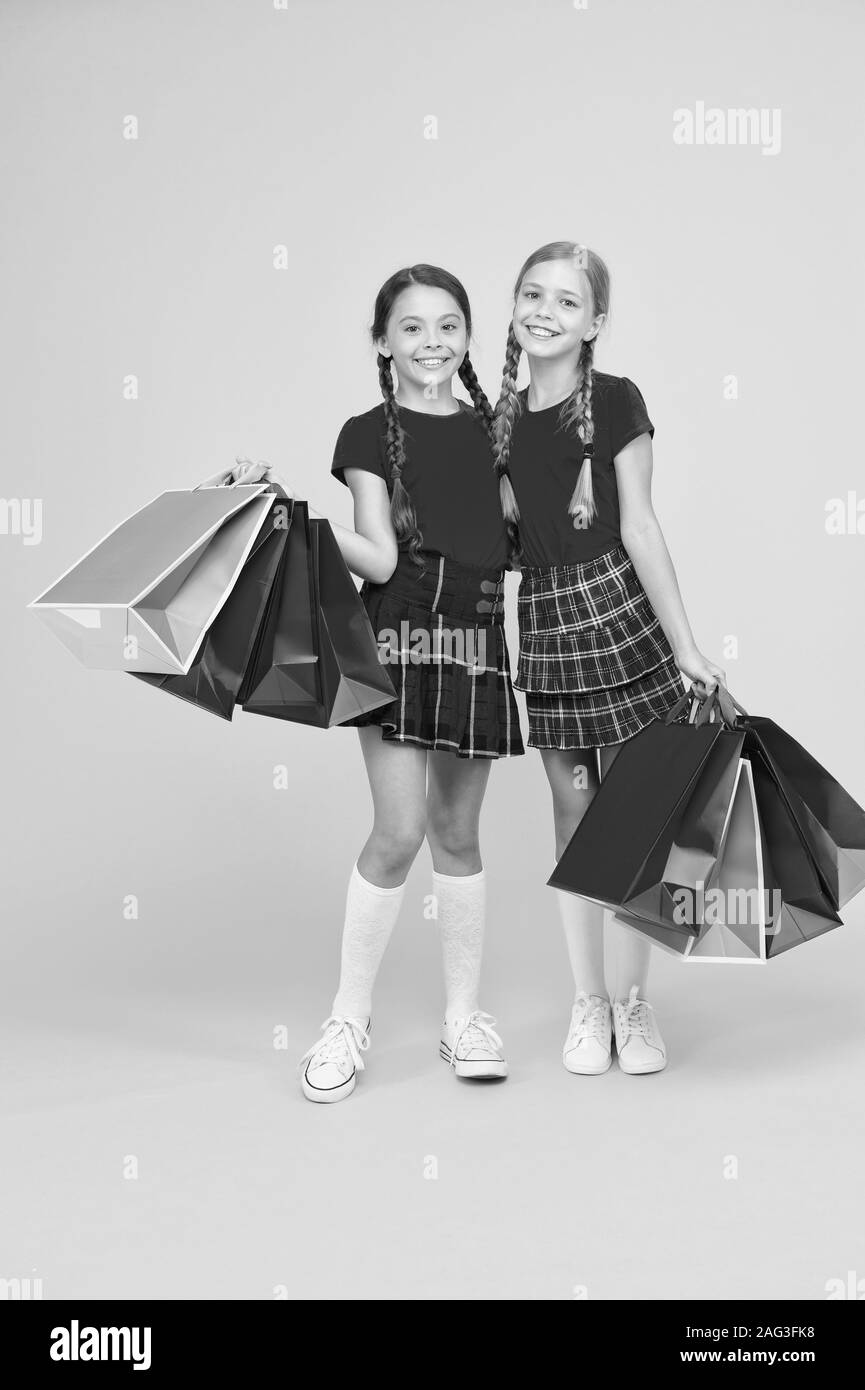 Gifts and souvenirs. Shopping with friend. Children hold packages. Best