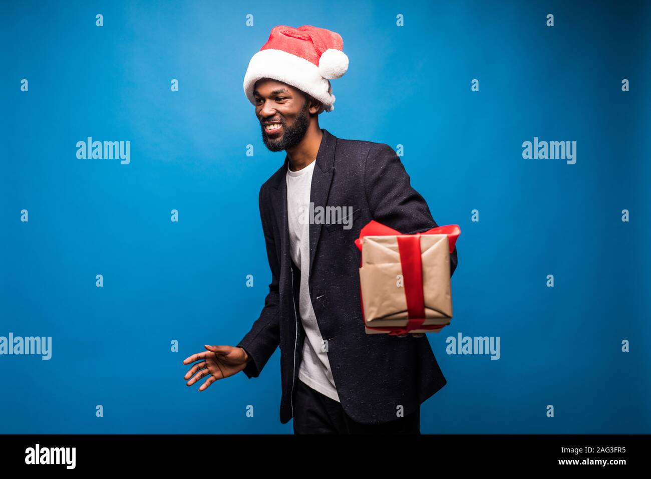 African man wearing santa hat hi-res stock photography and images - Alamy