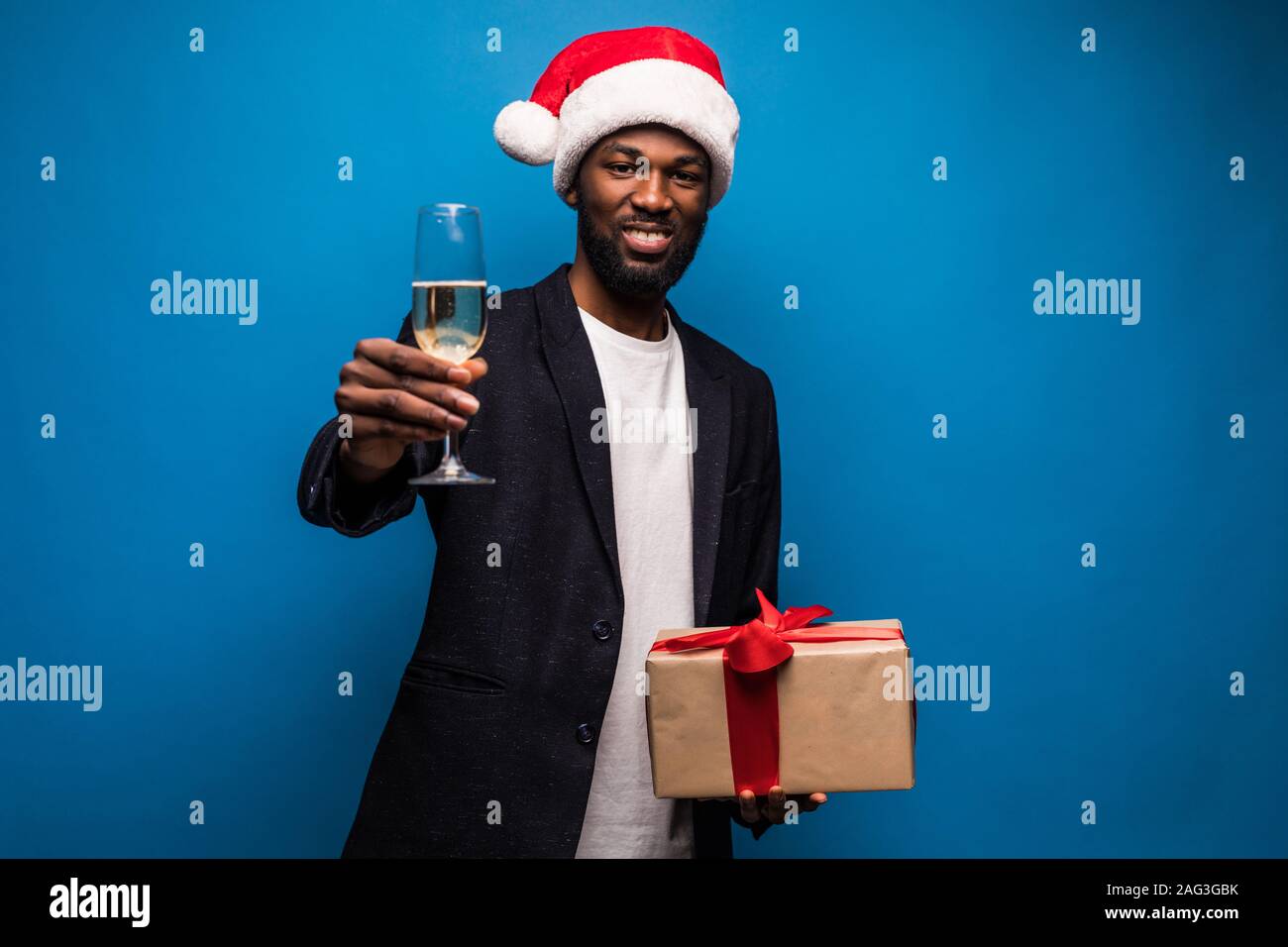 African man wearing santa hat hi-res stock photography and images - Alamy