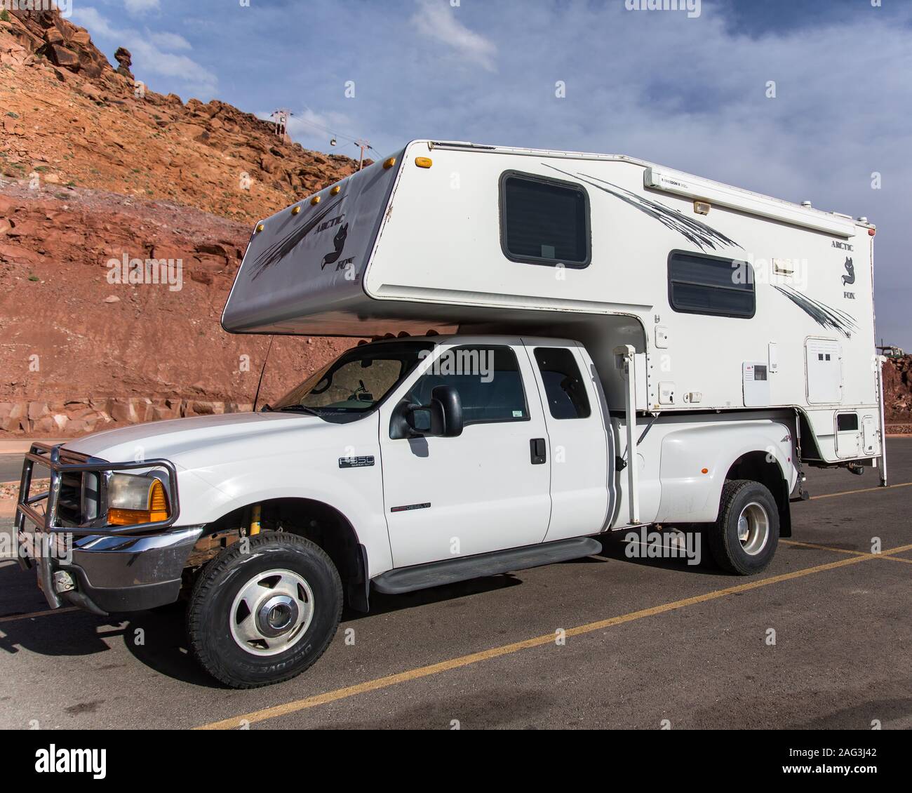 Arctic Fox truck camper on a 1999 4WD Ford F-350 Diesel Truck. Stock Photo