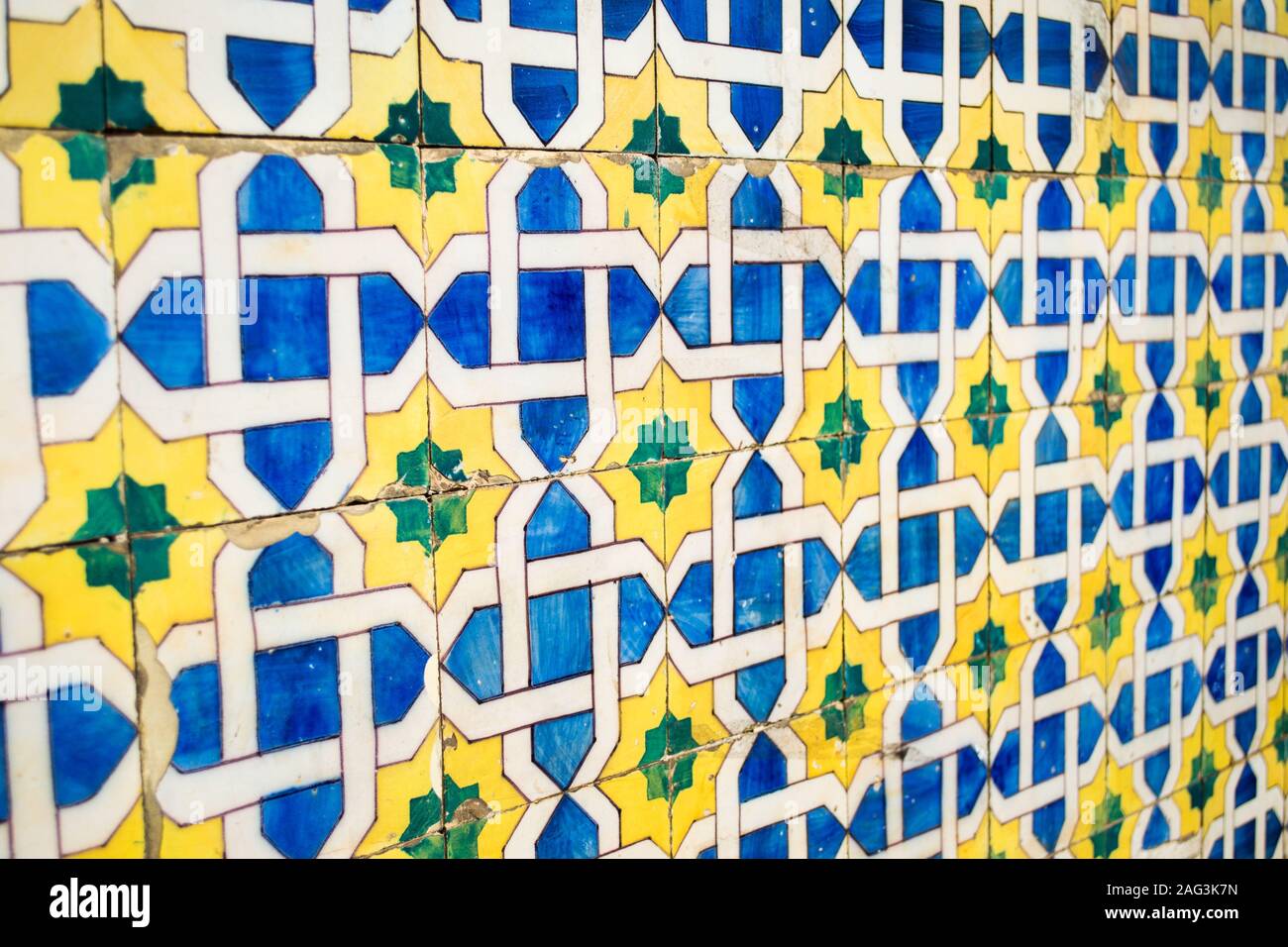 Wall of blue and yellow mosaic tiles perfect for use as background