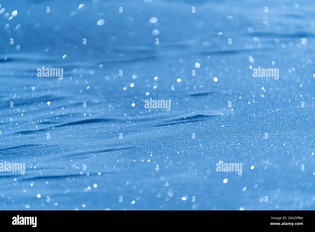 Christmas background of blue snowing with bokeh effect Stock Photo - Alamy