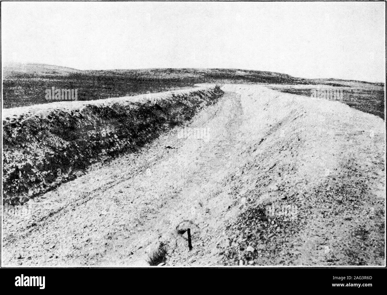 . Principles of irrigation engineering, arid lands, water supply, storage works, dams, canals, water rights and products. Fig. C.—Excavating canal by use of excavator with belt conveyor, drawn bytraction engine. Belle Fourche Project, So. Dak.. Fig. D.—Finished canal with both upper and lower banks. Lower Yellowstone Project, Mont. DESIGN AND CONSTRUCTION OF CANALS 49 In building embankments team work has an advantage over othermethods on account of the consolidation of the embankments dueto the tramping of the animals. When embankments to hold waterare built by other methods it is necessary t Stock Photo