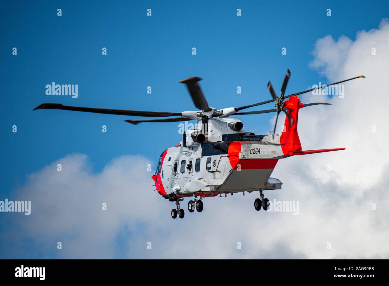 Offshore helicopter in the air to the oilrigs. Also used as rescue helicopter. Stock Photo