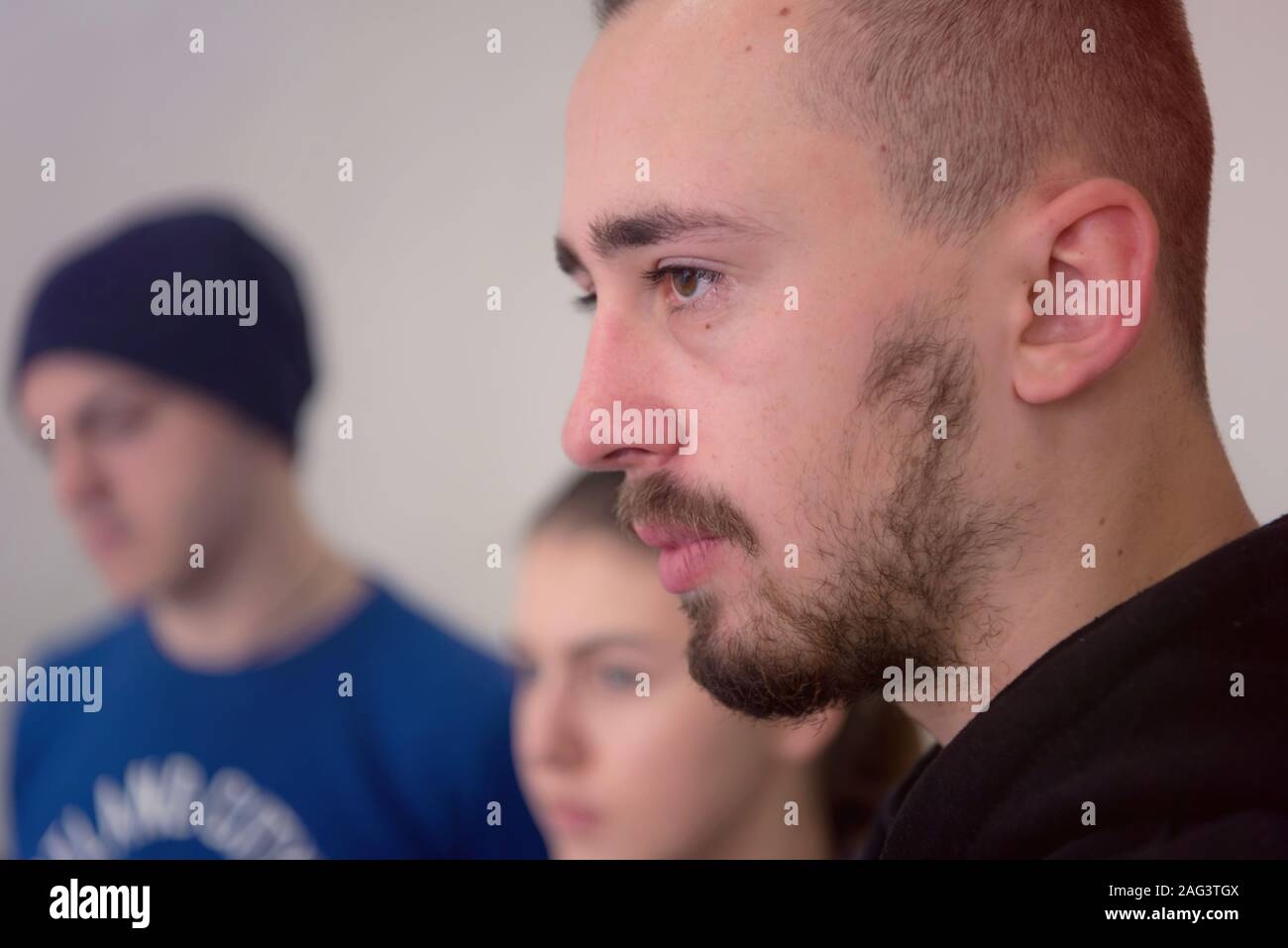 Group of  university architecture students working on practice lessons. Looking for solution during class. Stock Photo