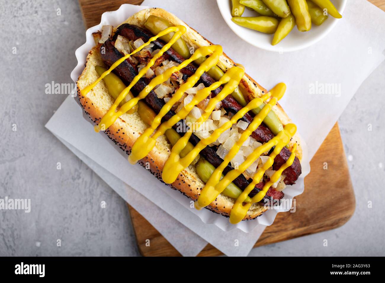 Hot dog on a poppy seed bun with onion Stock Photo Alamy
