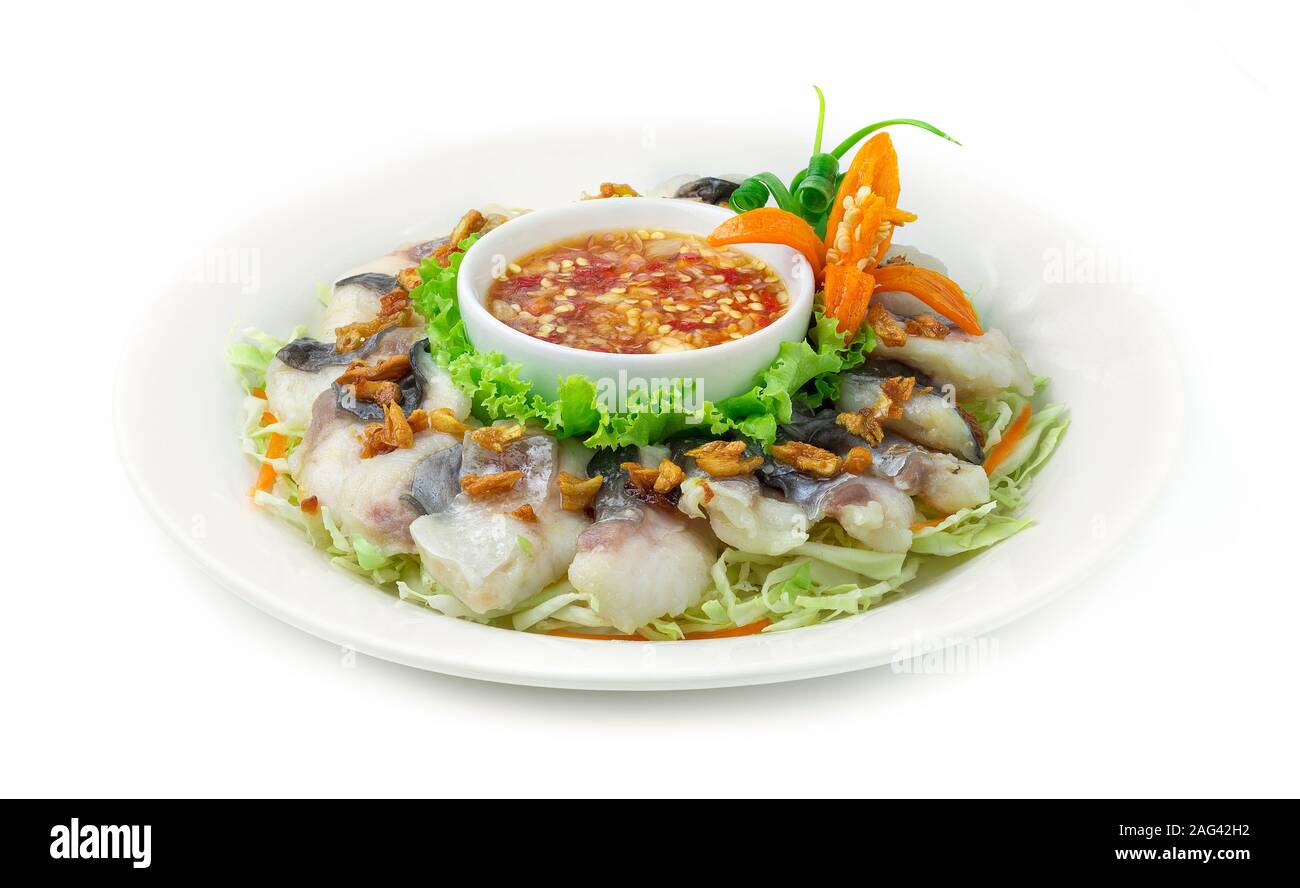 Steamed Pangasius Fish Blanching (Fresh Sea Dolly  Fish Boiled) Topped Crispy Garlic Served with Spicy Seafood sauce Thai Food Style goodtasty decorat Stock Photo