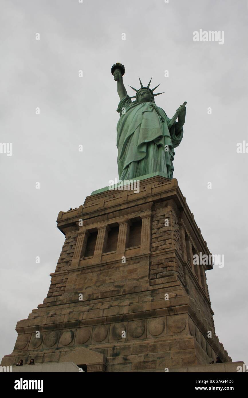 Vertical low angle shot of The Statue of Liberty in New York City Stock ...