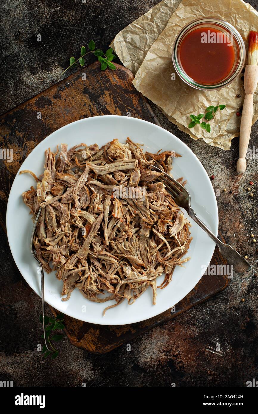Pulled pork with forks on a plate Stock Photo