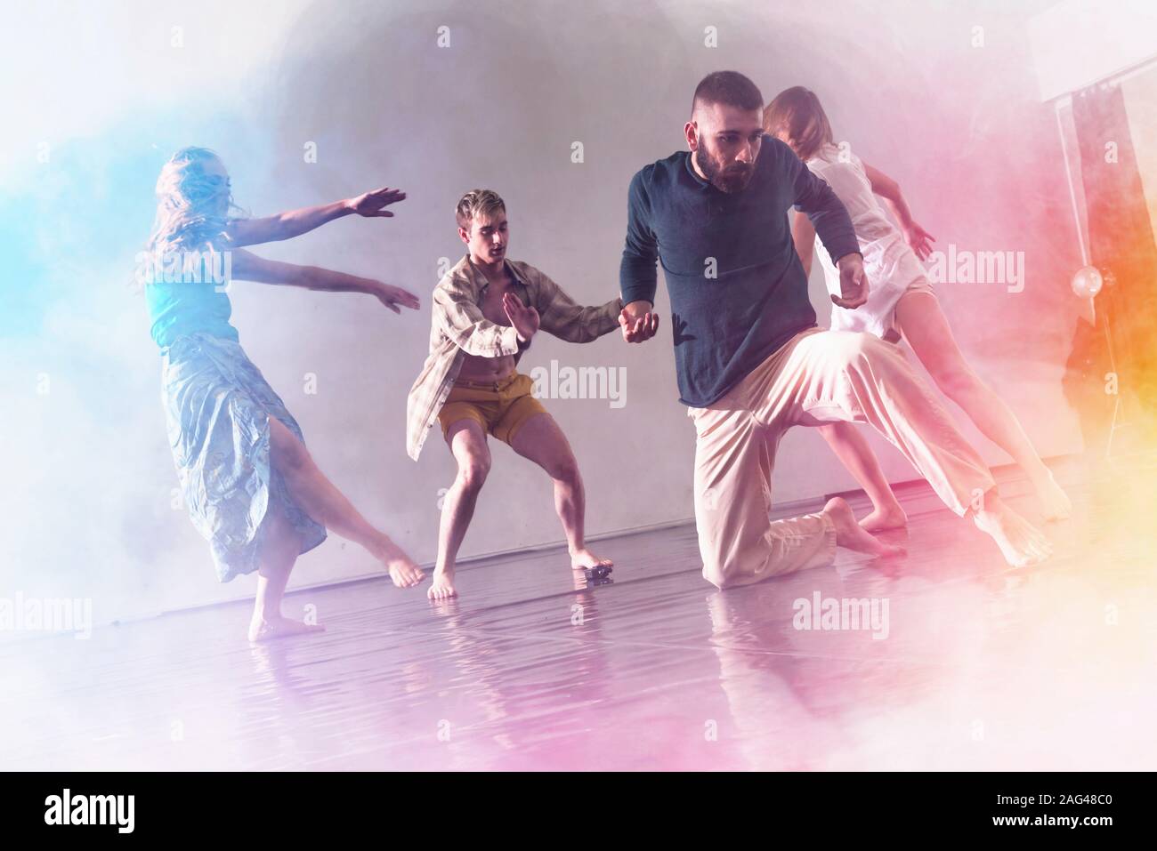Young modern dancers dancing in the studio. Sport, dancing and urban ...