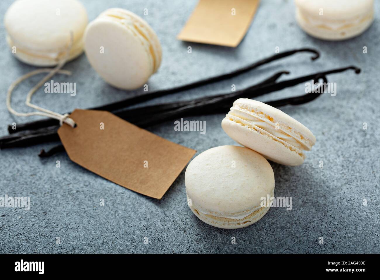 Vanilla macarons on a gray surface Stock Photo