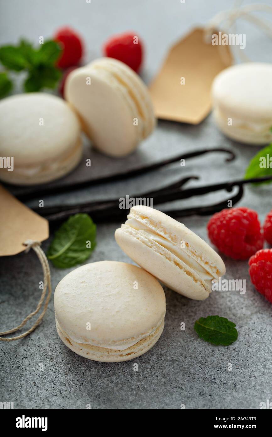 Vanilla macarons on a gray surface Stock Photo
