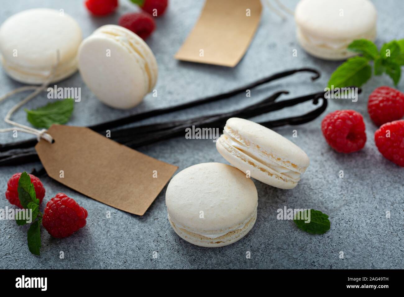 Vanilla macarons on a gray surface Stock Photo