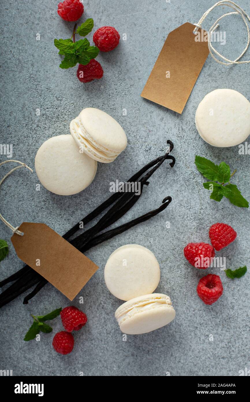 Vanilla macarons on a gray surface Stock Photo