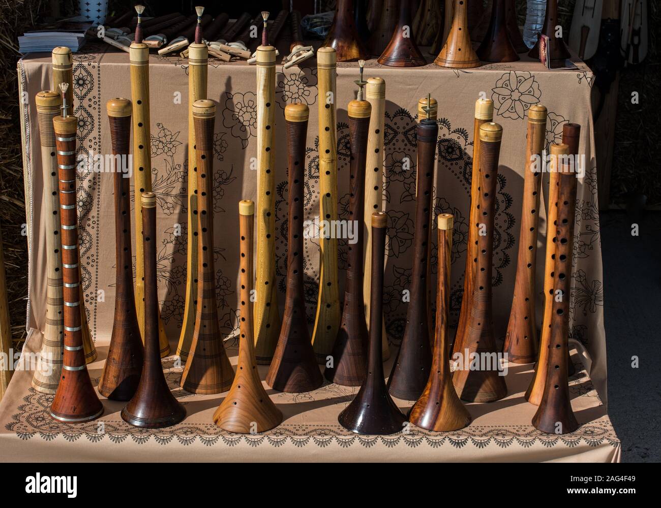 Dozens of handmade wooden flutes or shrill pipe Stock Photo - Alamy