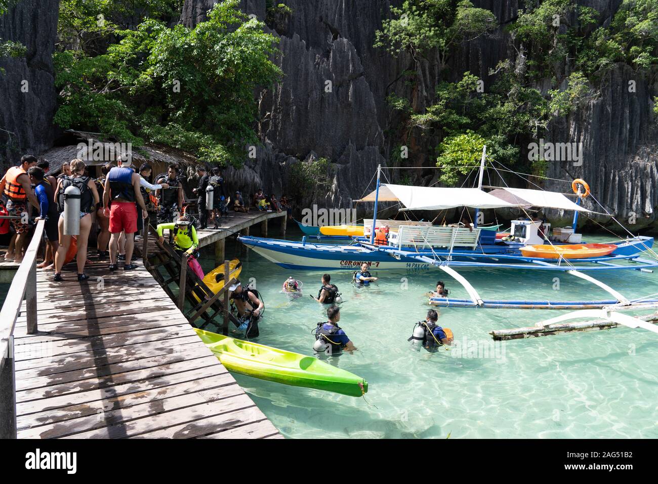 A group of tourists wearing Scuba equipment at one of the lakes located at Coron island,Palawan,Philippines Stock Photo