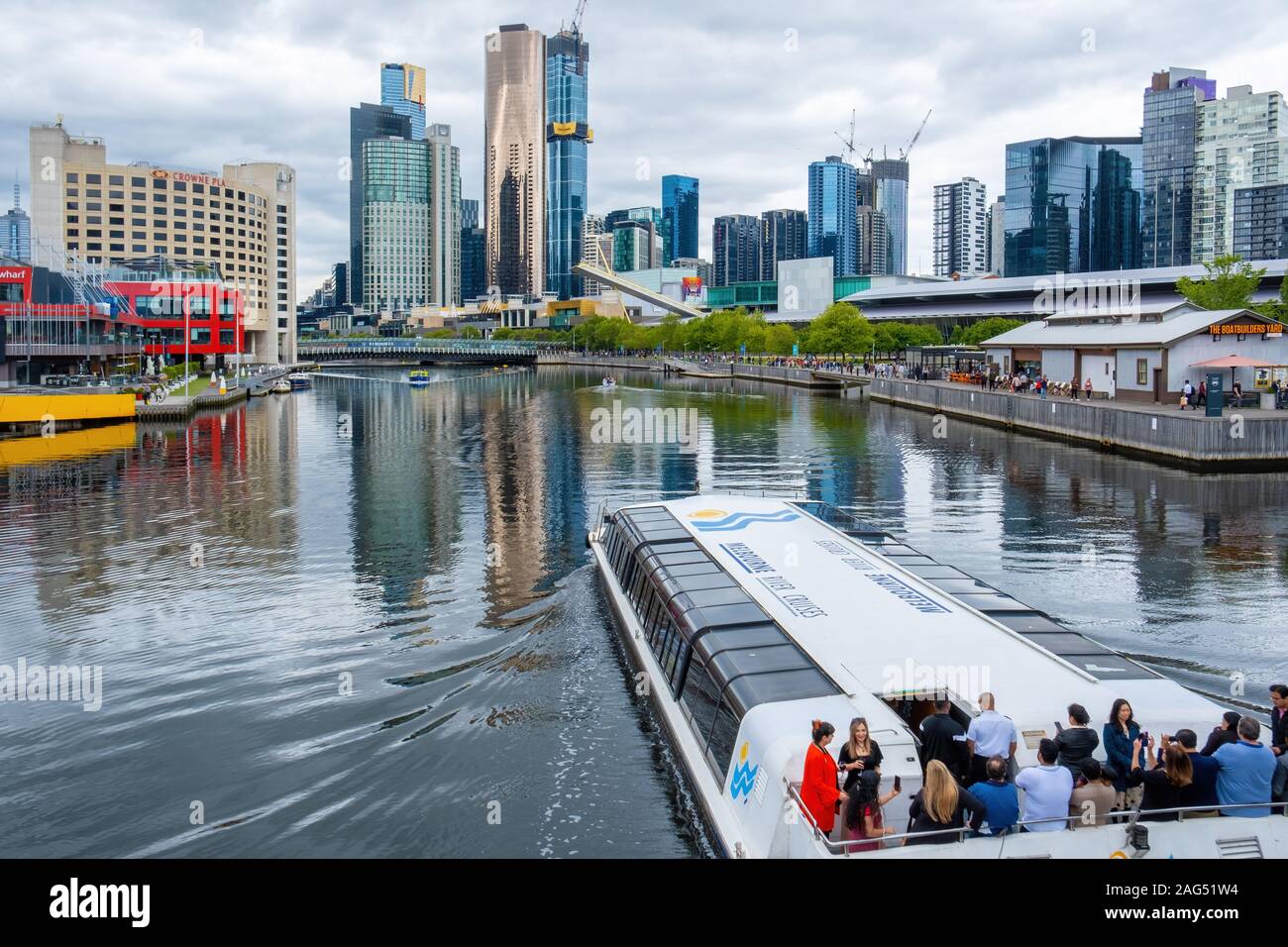Melbourne, Australia - December 14, 2019: Tourists sailing on Melbourne River Cruises ferry along Yarra river Stock Photo