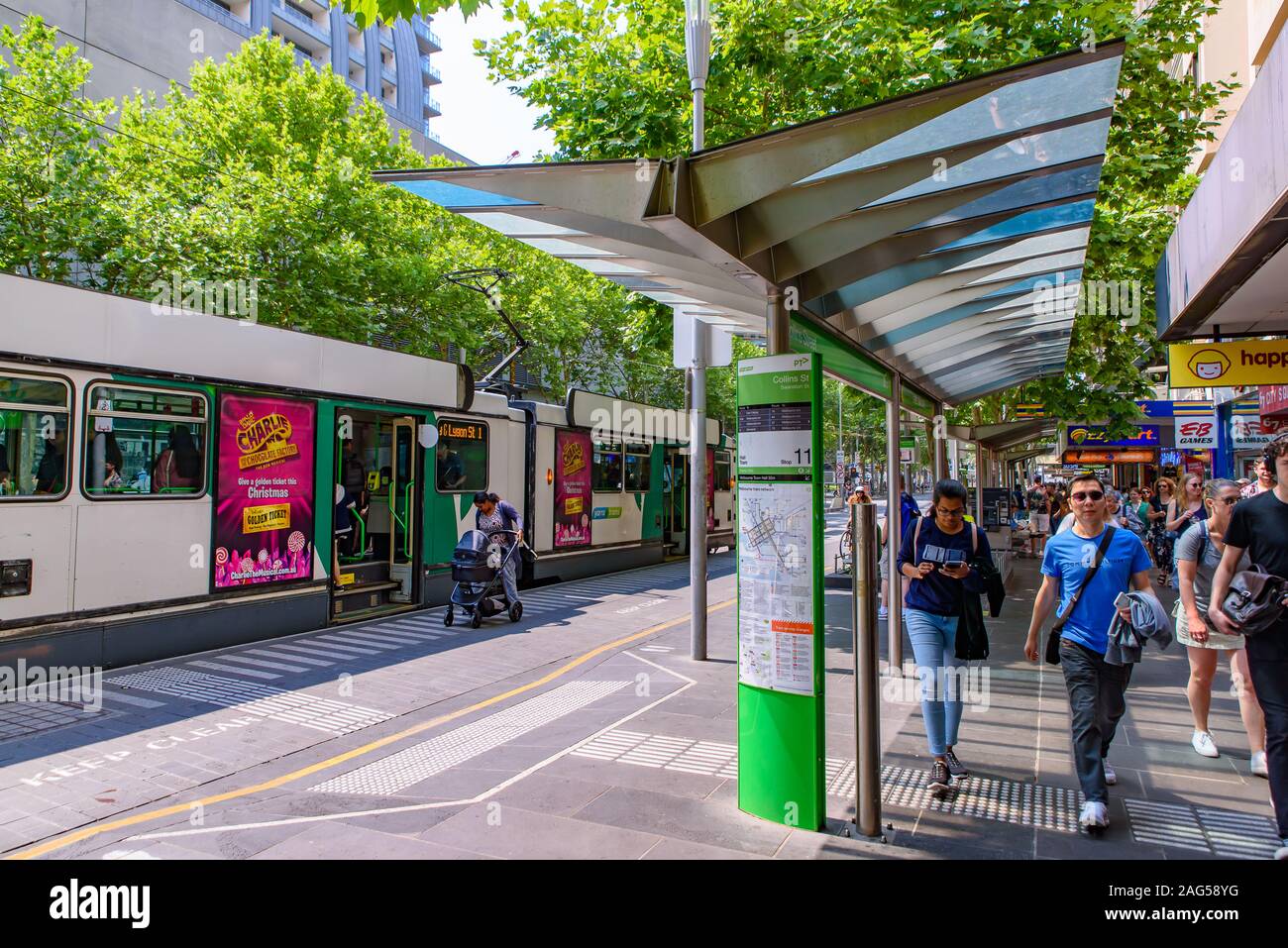 A tram stop on the street in Melbourne city center, Australia Stock Photo