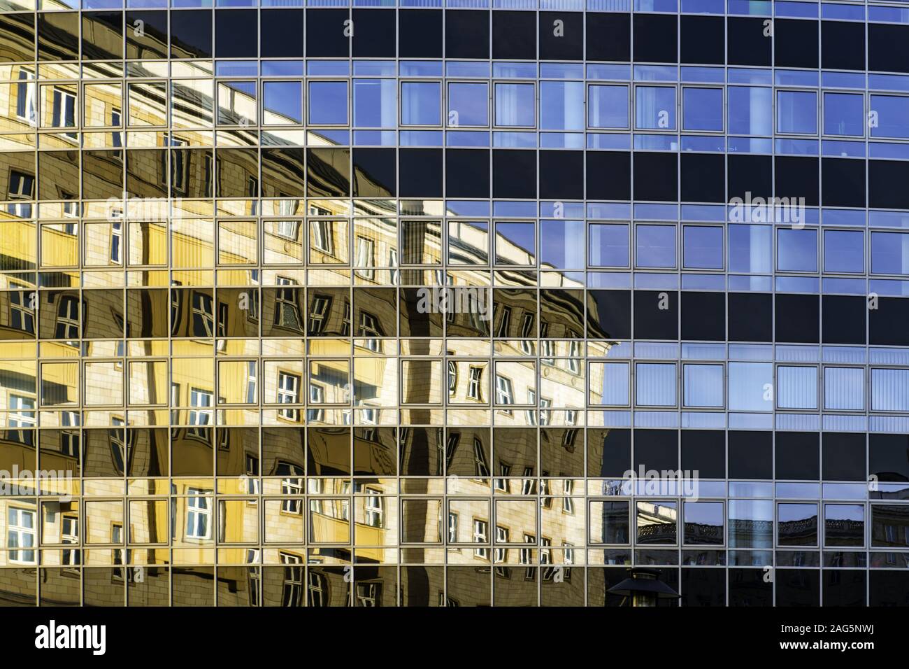 Beautiful shot of a modern building reflecting the life it witnesses Stock Photo