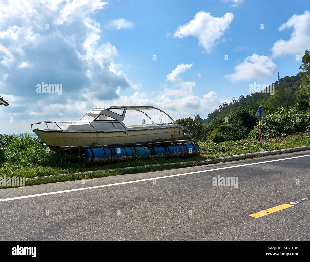 DA NANG, VIETNAM - NOVEMBER 20, 2019: Boat next to the street at Son Tra Mountain Stock Photo