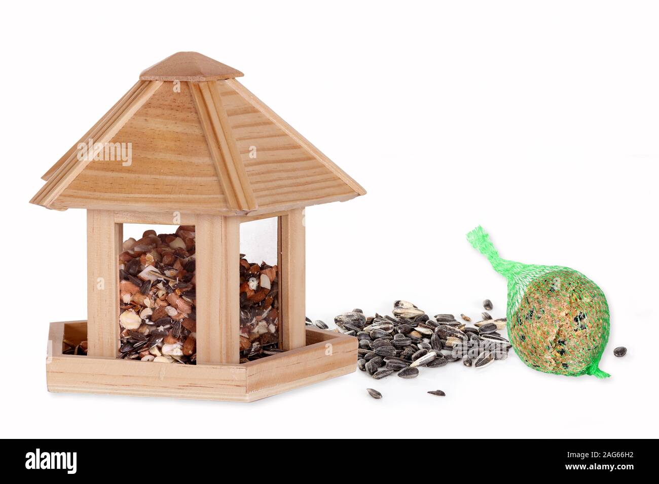 Bird seed in a bird box with a fat ball Stock Photo