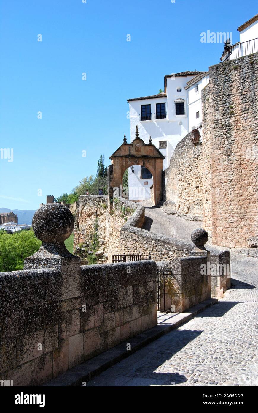 View along the old bridge towards the Philip V arch, Ronda, Malaga Province, Andalucia, Spain, Europe. Stock Photo