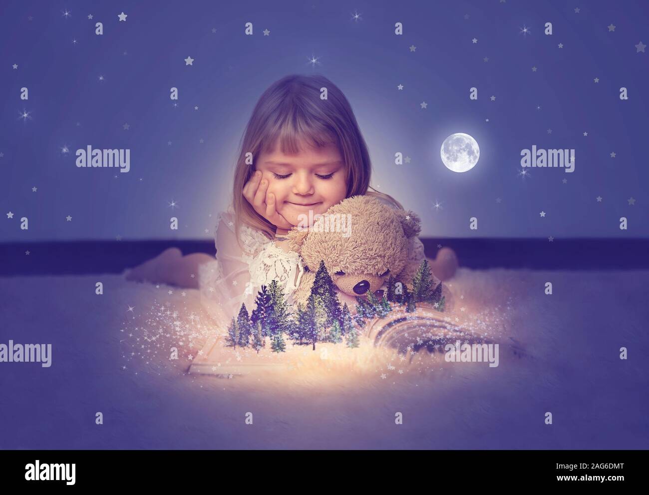 Little girl with her teddy bear, watching a enchanted forest on the ...