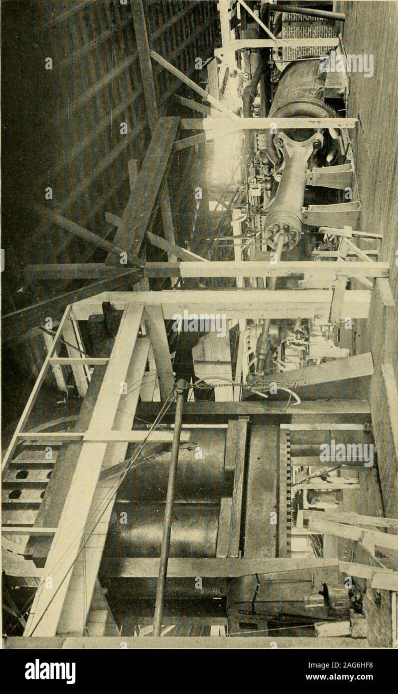 . Louisiana and Arkansas railway; its territory industries and financial condition ... ut between two sets of fine teeth, one set ona rapidly-revolving cylinder. This arranges the fibres inparallel lines on the cylinder, from which it is taken in theform of a very light fleece and passed through a funnel, issu-ing in the form of a cord of cotton fibre about half an inchthick. In order to insure uniformity, several of these cordsare combined by a drawing frame, after which the embryocotton yarn passes successively to the slubbing frame, theintermediate frame, the roving frame and the fineroving Stock Photo