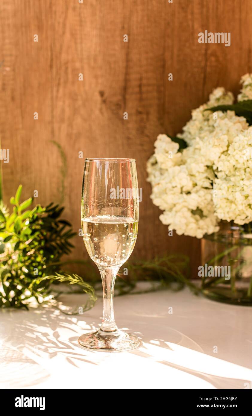 Rose blush wine in glasses. Bottle of rose wine with flowers on