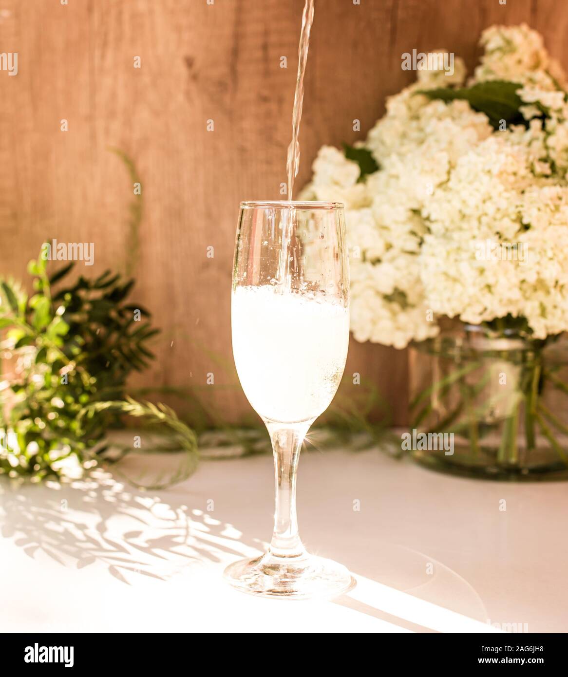 Rose blush wine in glasses. Bottle of rose wine with flowers on