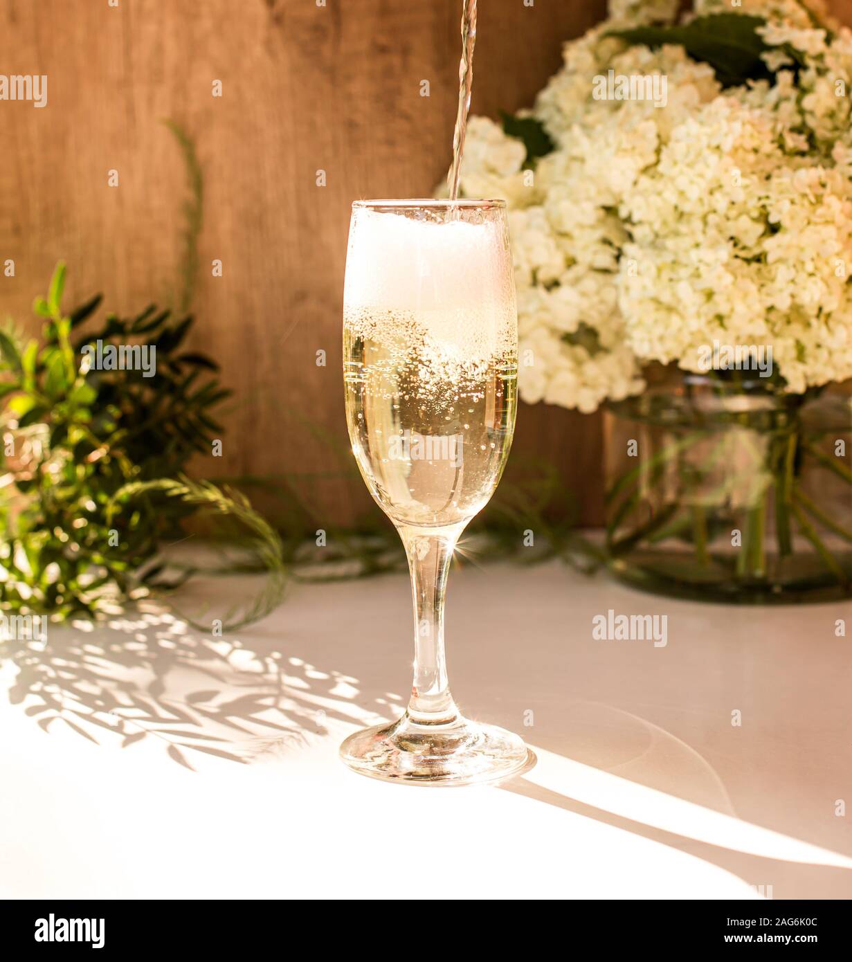 Rose blush wine in glasses. Bottle of rose wine with flowers on