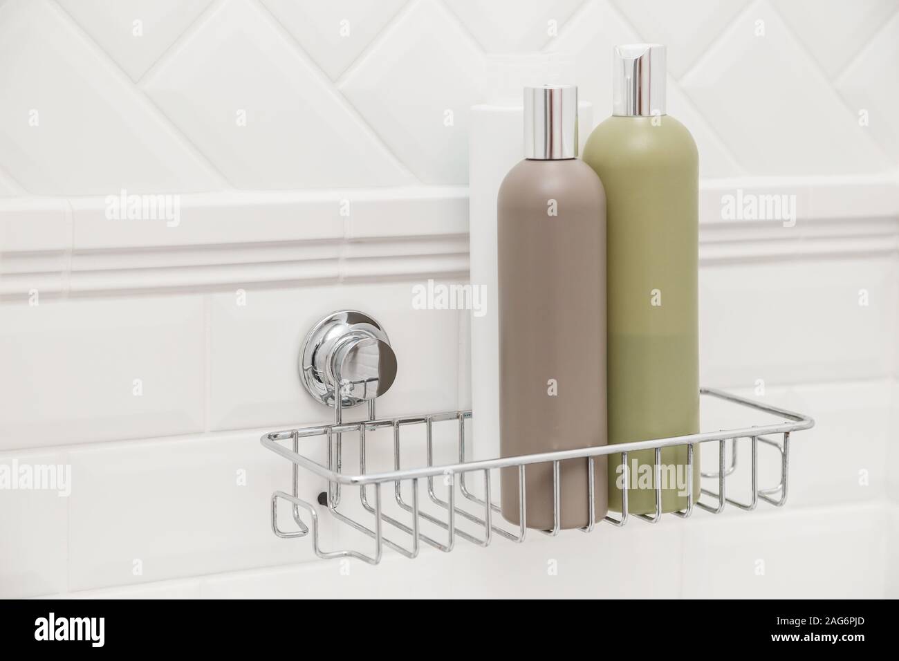 Toiletries bottles on suction cups compact bath shelf, fixing on tiled wall without drilling