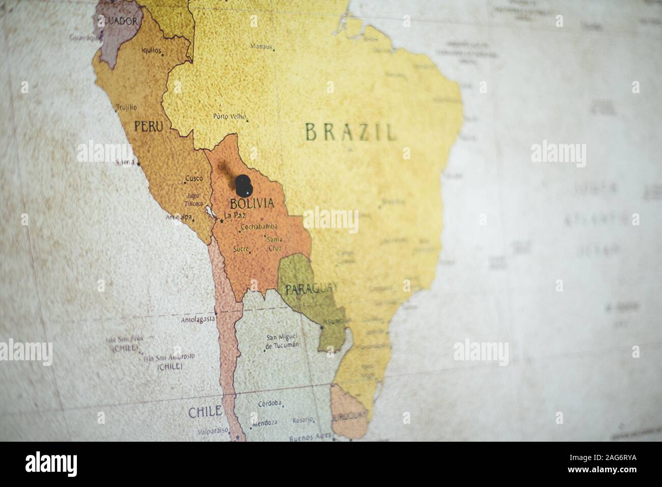 Closeup shot of a black pin on the Bolivia country on the map Stock Photo