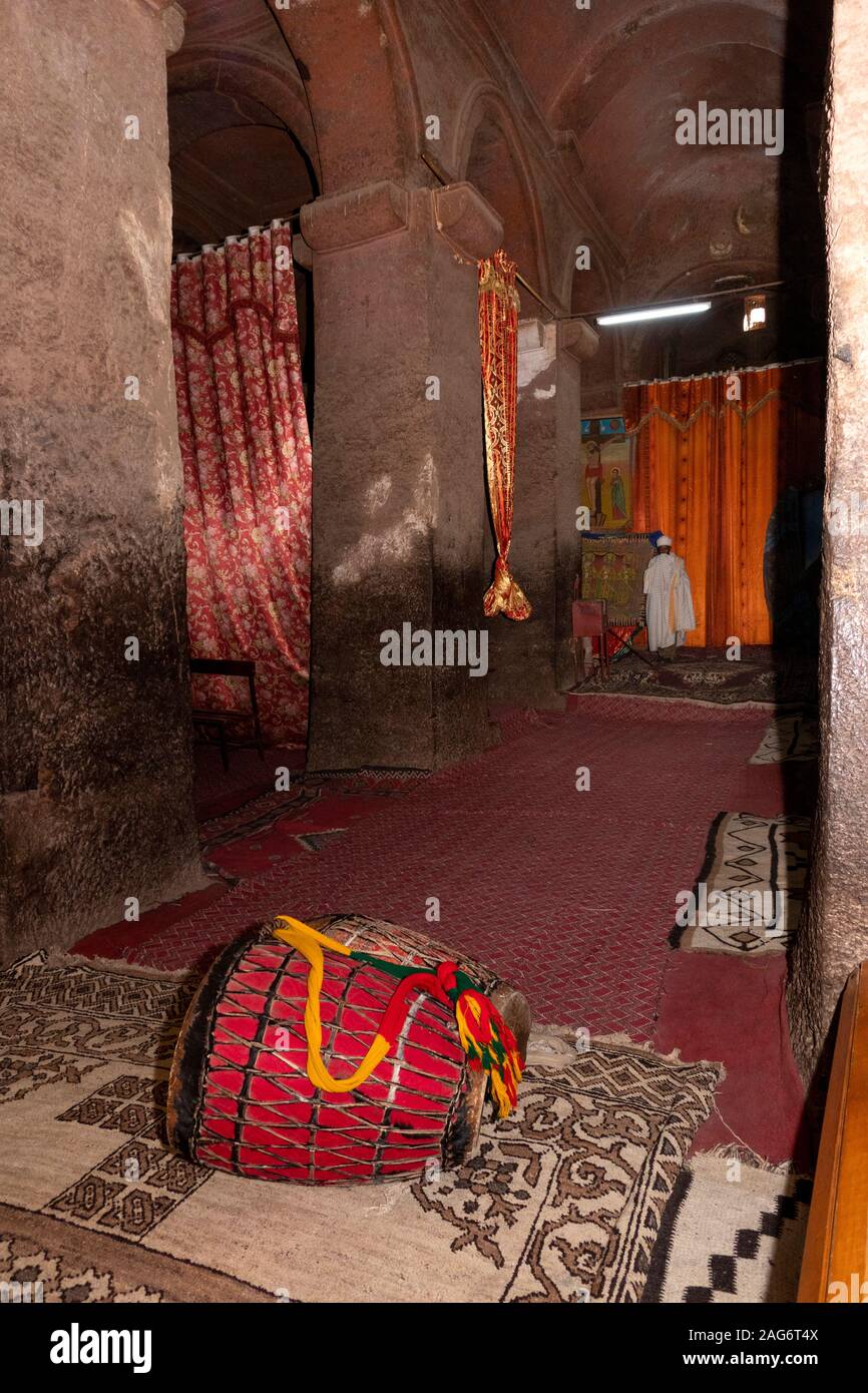 Ethiopia, Amhara, Lalibela, ancient rock cut churches, inside Bet Medhane Alem church, ritual drums used in mass Stock Photo