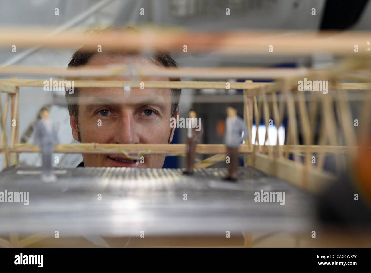 Cologne, Germany. 10th Dec, 2019. Astronaut Matthias Maurer observes figures in a model of the Luna project at the European Astronaut Centre (EAC) on the ESA premises. Credit: Felix Hörhager/dpa/Alamy Live News Stock Photo