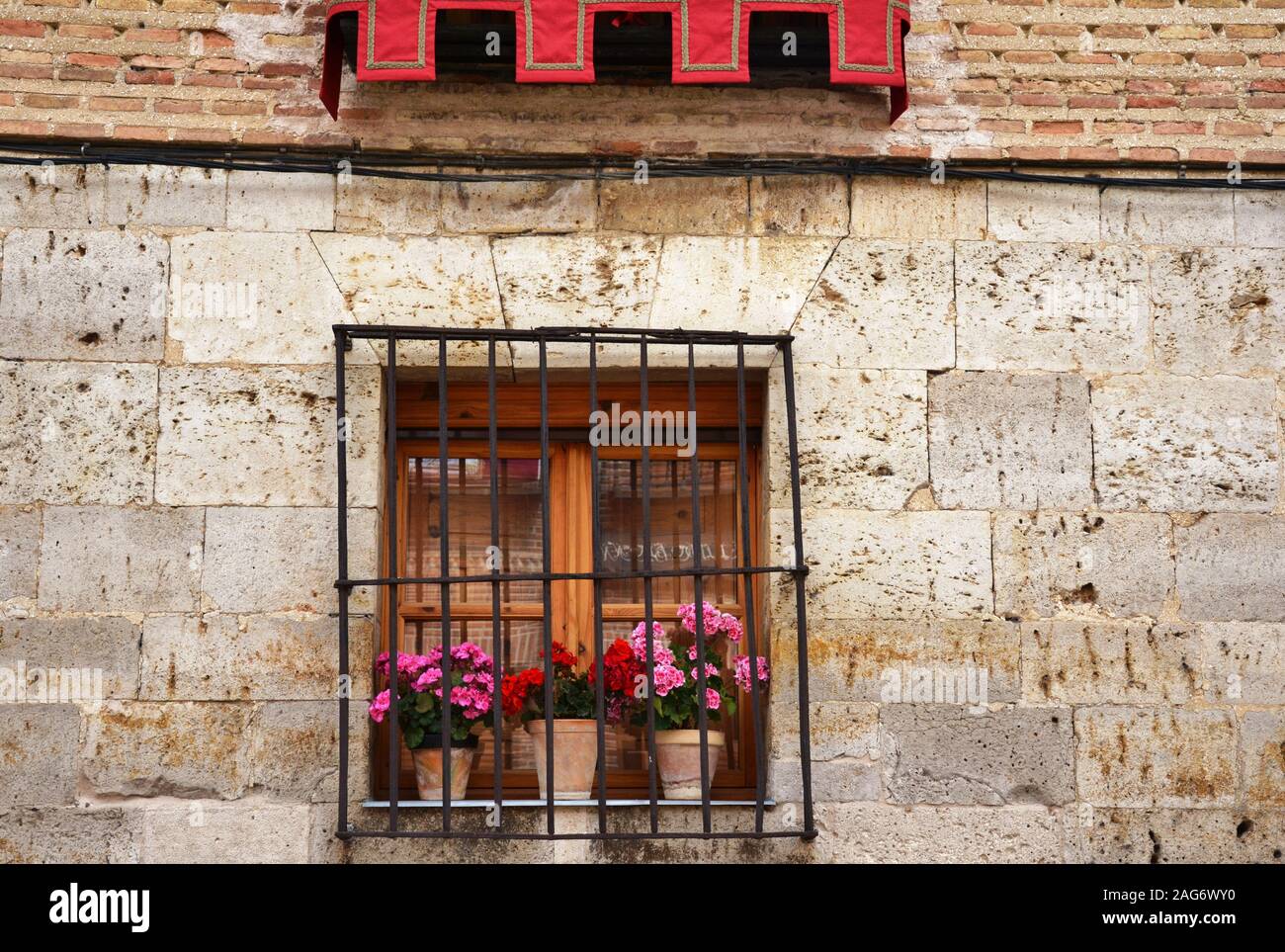 window decorated with pink flowers Stock Photo