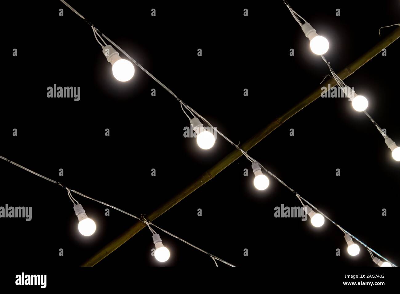 LED Lamp String on Black Night Scene Background. LED light on black background Stock Photo