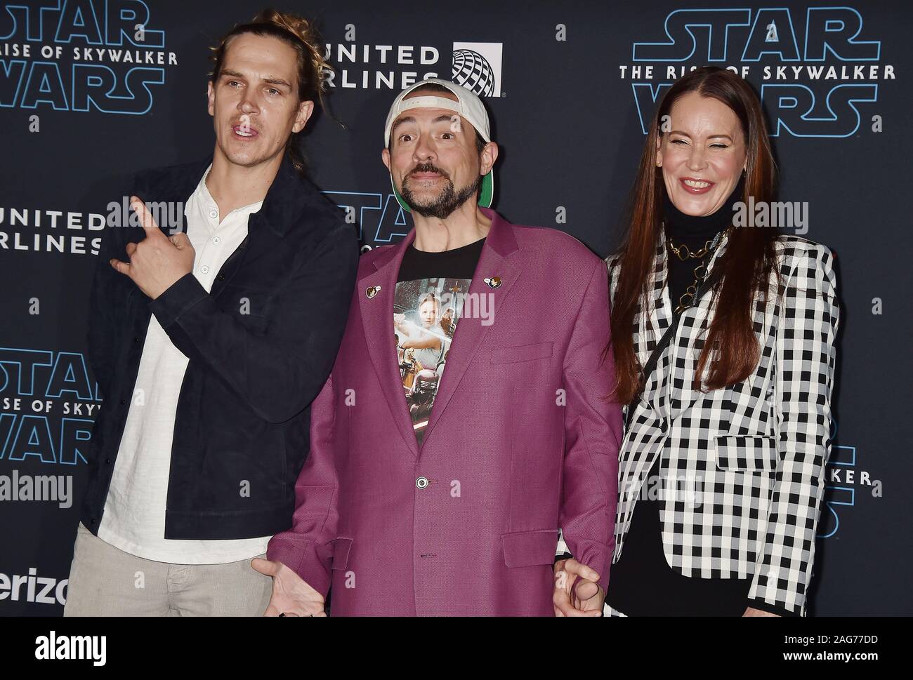 HOLLYWOOD, CA - DECEMBER 16: (L-R) Jason Mewes, Kevin Smith and Jennifer Schwalbach attend the Premiere of Disney's 'Star Wars: The Rise Of Skywalker' at the El Capitan Theatre on December 16, 2019 in Hollywood, California. Stock Photo